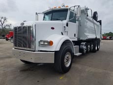 Peterbilt Super Dump - Driver Front Angle Axles Up