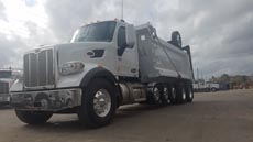 Peterbilt 567 Super Dump - Driver Front Angle Axles Up